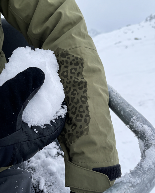 Olive Catshift sleeve showing the cheetah print where it's wet